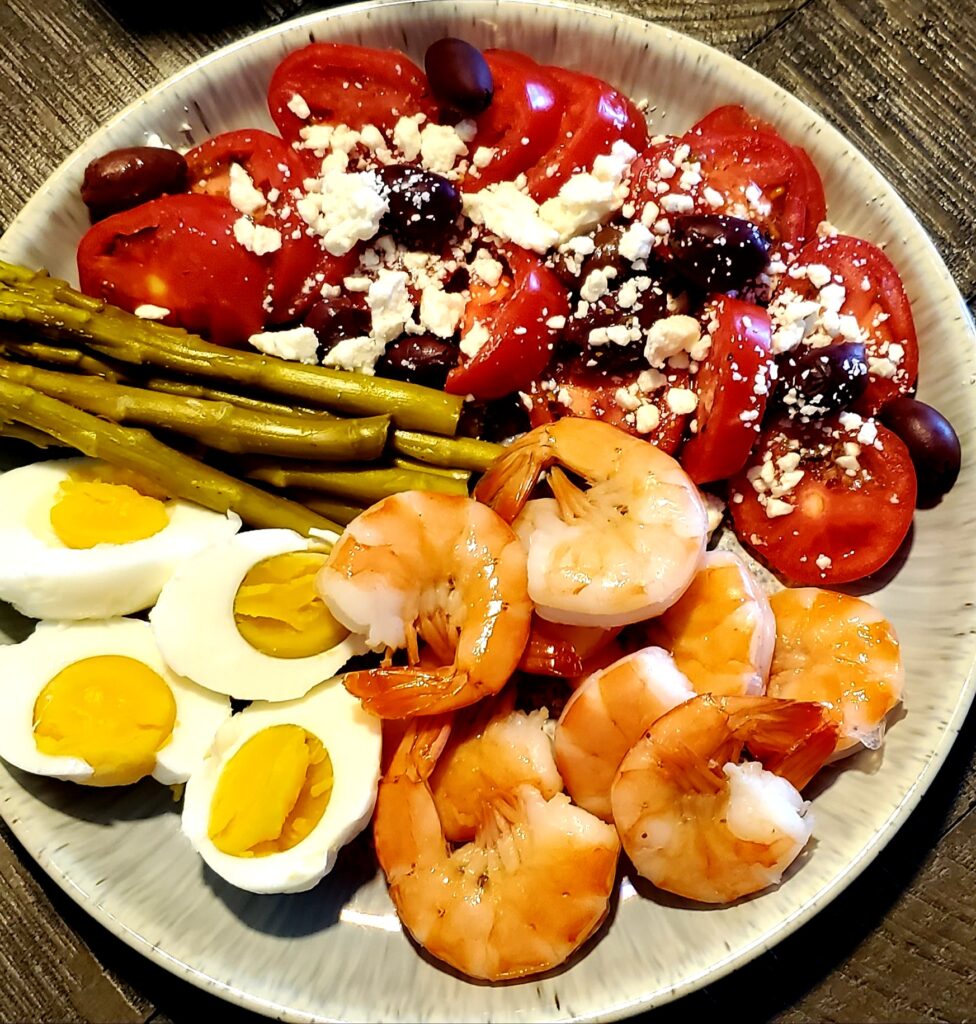 Shrimp, boiled eggs, tomatoes, and pickled asparagus